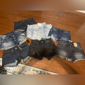 It of 8 pair of size 25 denim shorts.  All new with tags or not worn.